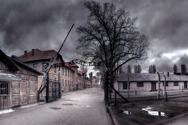 A grim photograph of the gates to Auschwitz