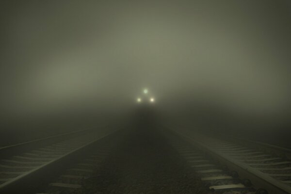 An approaching train out of the fog