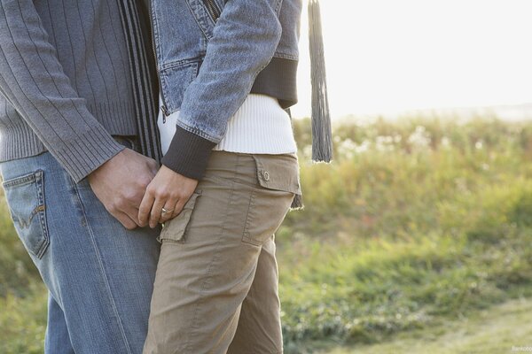 A man and a woman embrace at dawn