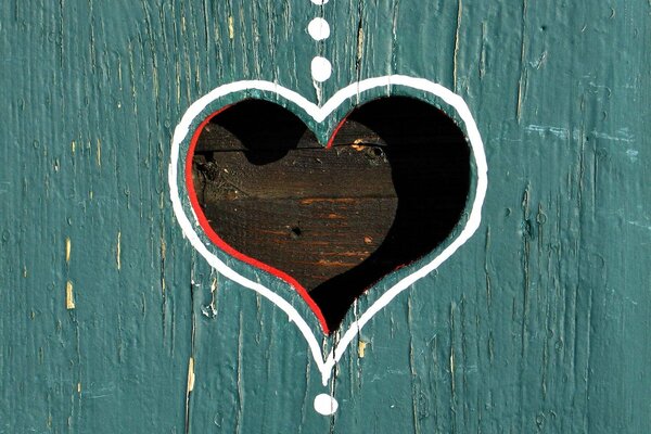 A heart made of wood on the fence romance