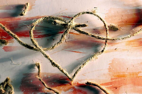 Photo de Zeek Barnaul avec un nœud de fouet en forme de coeur