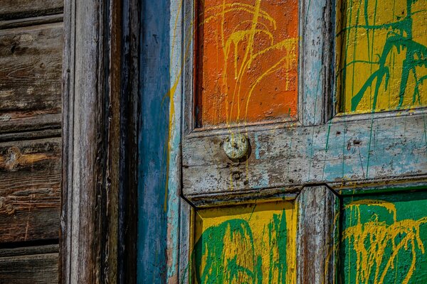 An old wooden door, doused with paint