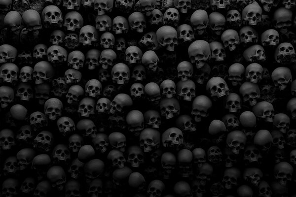 Es gibt viele Schädel auf schwarzem Hintergrund
