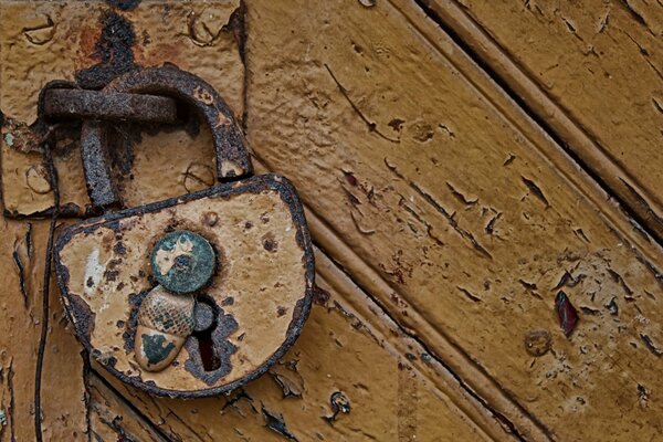 Rusty lock with an acorn-shaped latch
