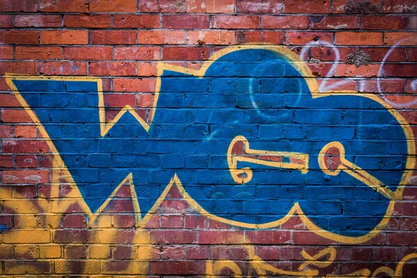 Pared pintada con graffiti azul