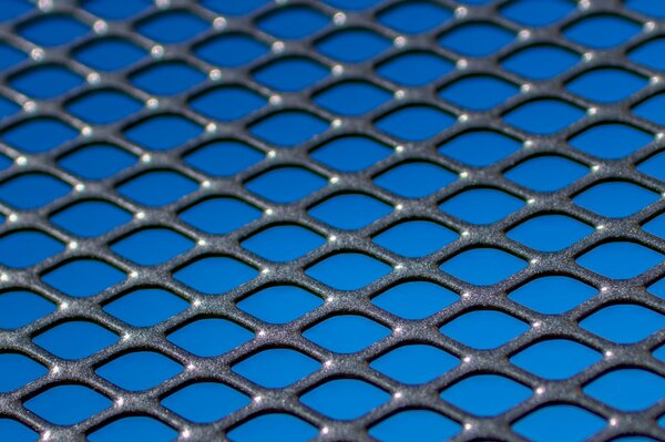 Blue background with metal mesh