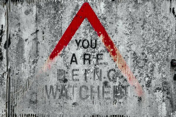 red warning sign you are being watched 