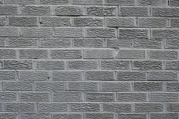 Muro di mattoni grigi