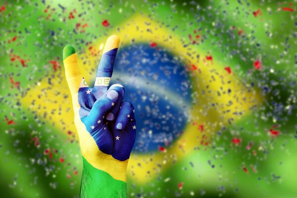 Victory sign on the Brazilian flag
