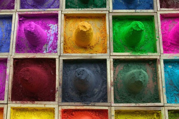 Boxes with colored paint powders