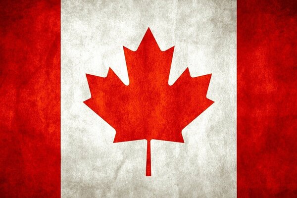 The red and white flag of Canada with the image of a maple leaf