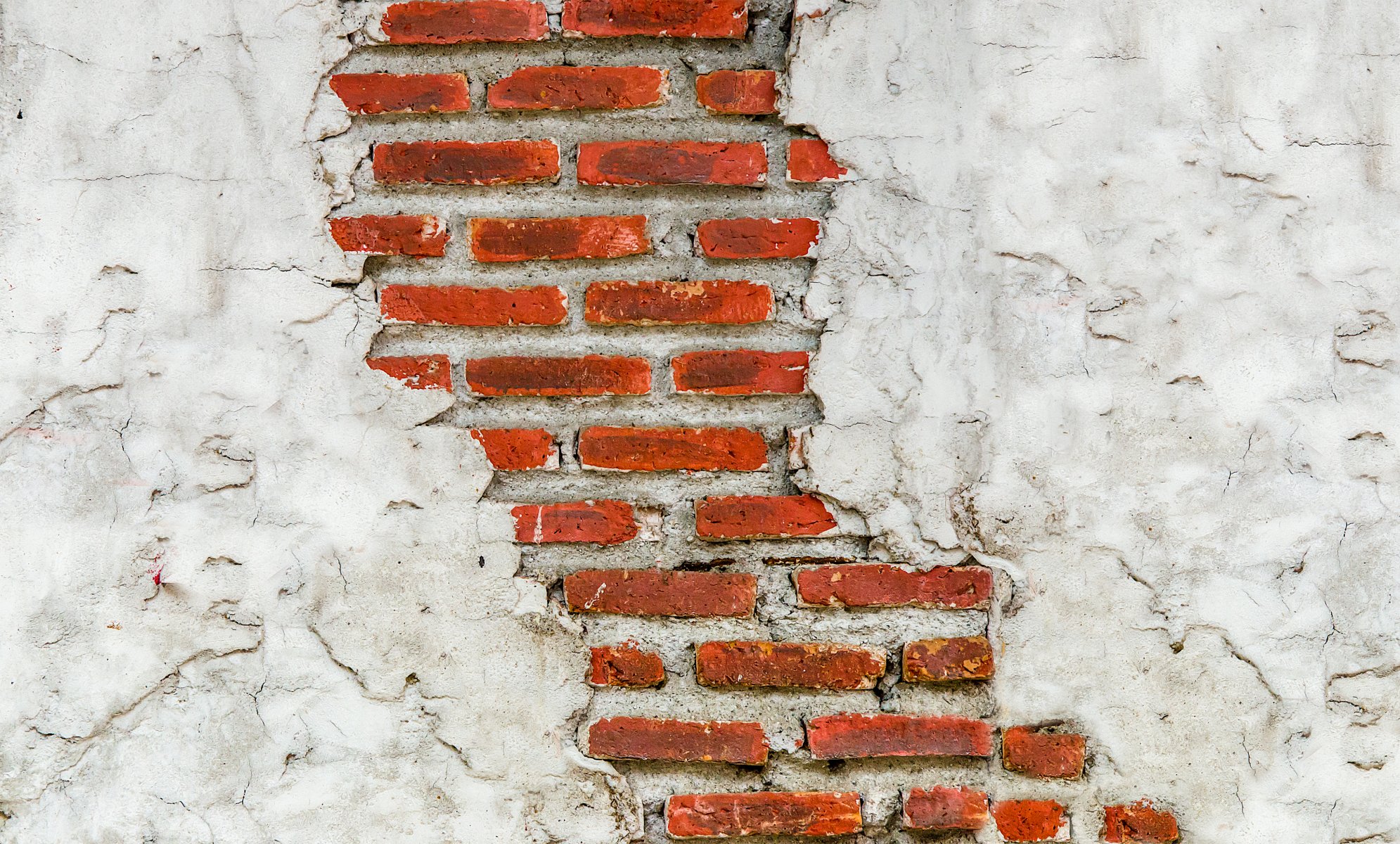 pared ladrillo mampostería yeso grietas textura