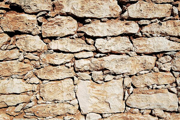 Textured brown stone wall