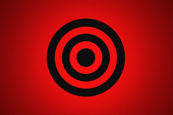 A black target on a red background