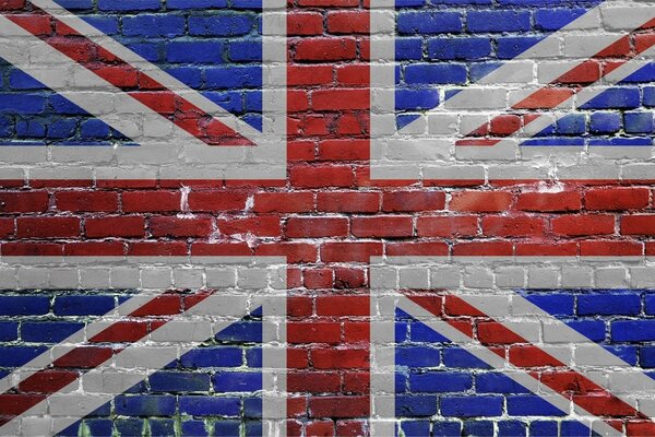 Drapeau britannique sur un mur de briques