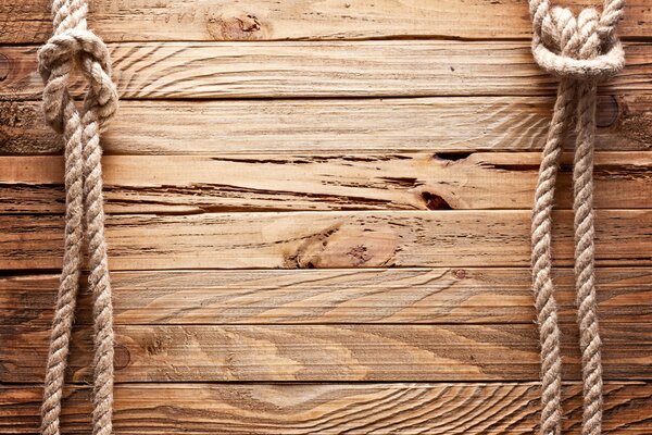 Rope knots on a wooden background