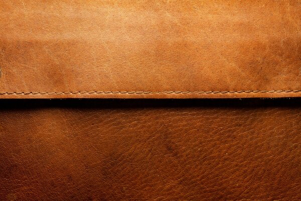 Brown leather fabric with stitching