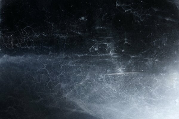 A lot of cracks on a black background