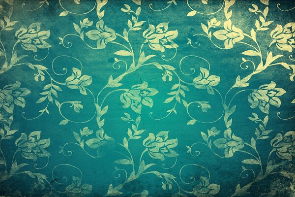 Papier peint vert avec des motifs et des fleurs