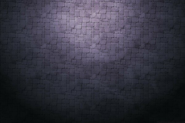 The texture of masonry in purple light