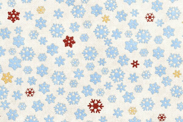 Fondo de tela-copos de nieve azules intercalados con rojos y amarillos