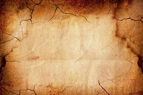 Paper background made of aged paper with cracks