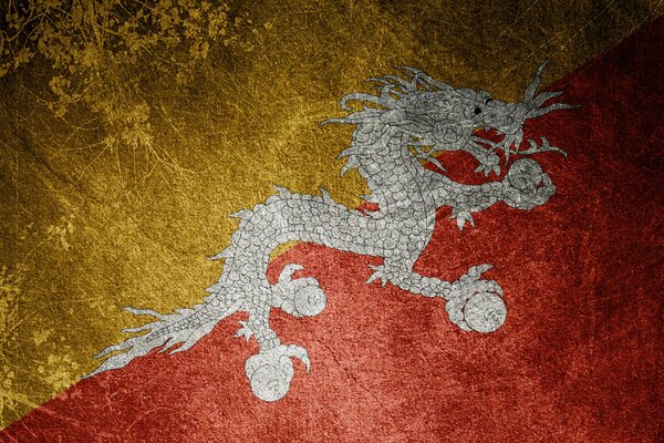 Eine Flagge mit einem Drachen zwischen goldenen und roten Leinwänden