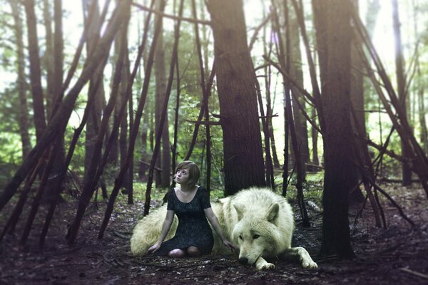 Fille avec un loup dans la forêt