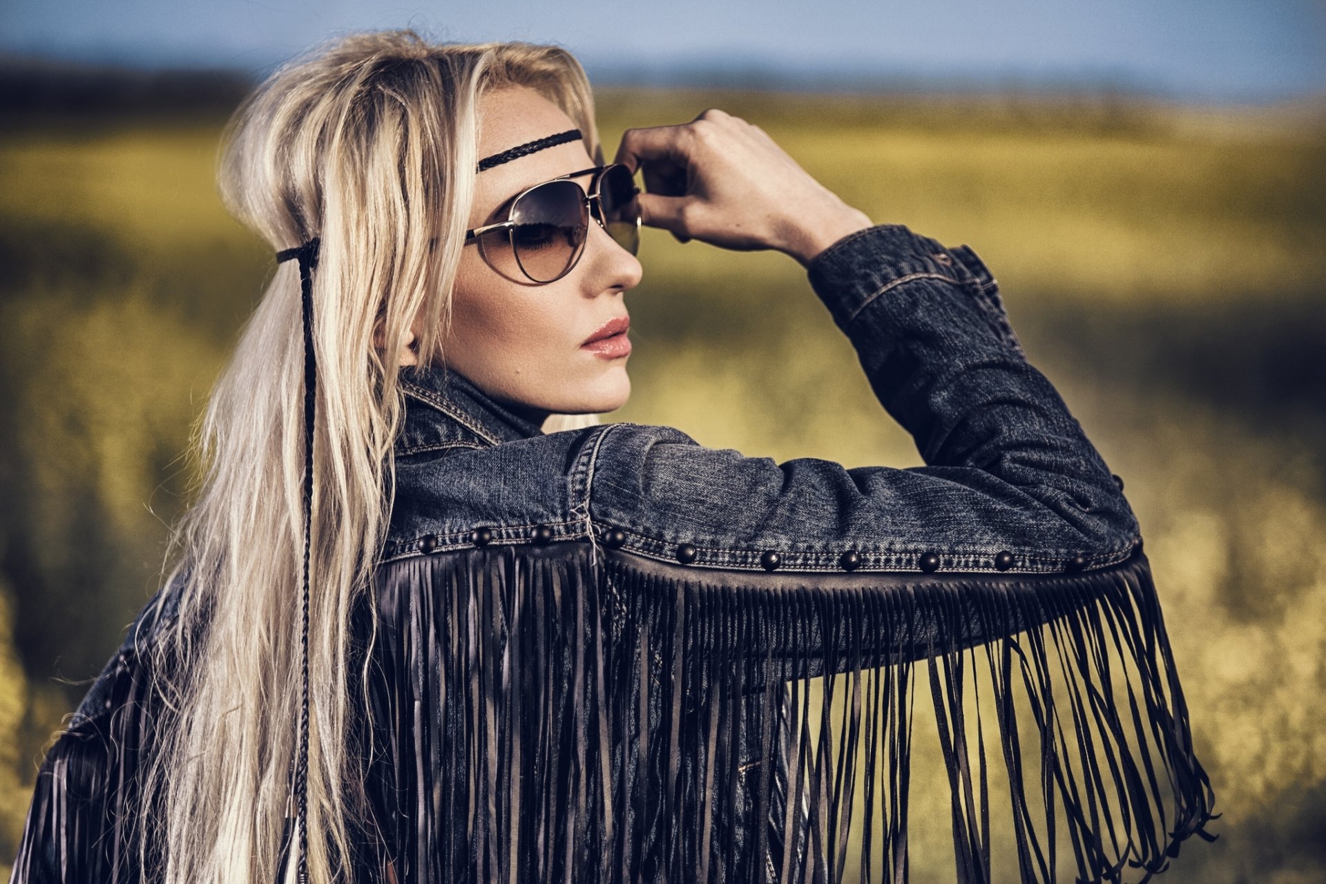 model hippie pose jeans jacket hair sunglasse