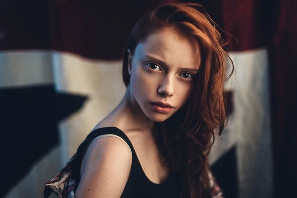 A good portrait of a girl with freckles