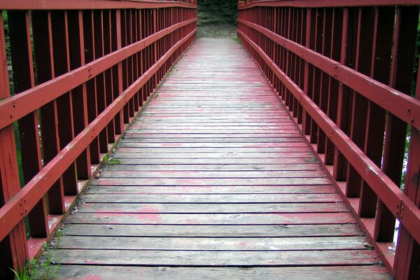 Wooden bridge with iron handrails