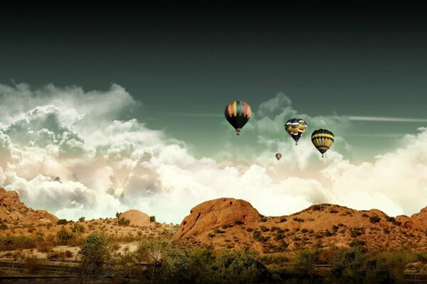 Balloons on the background of the sky and mountains