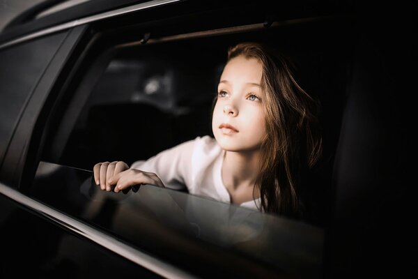 The car. car window. beautiful girl