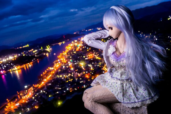 An anime-style doll over a night city