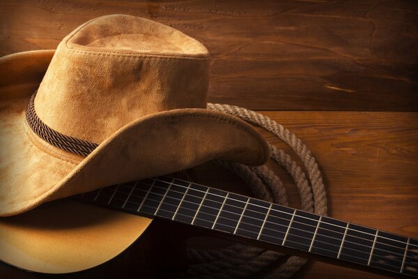 Cowboy hat on guitar and cable