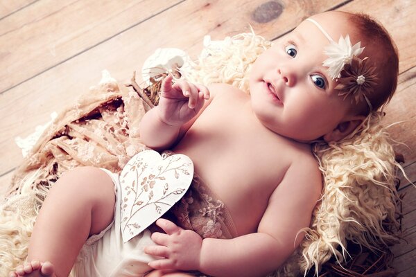 Cute baby in the image of an angel