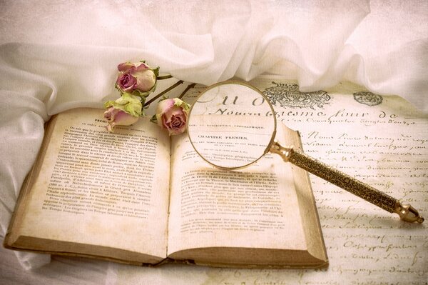 Vintage book next to roses