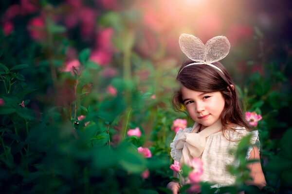 Children s photography. Girl in flowers