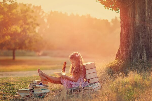 The girl is enthusiastically reading a book