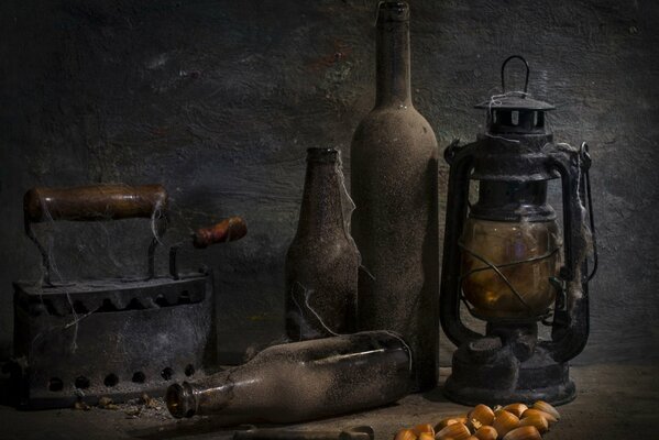 Vintage items iron, bottles, kerosene lamp