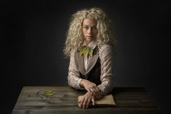 Curly blonde with a book