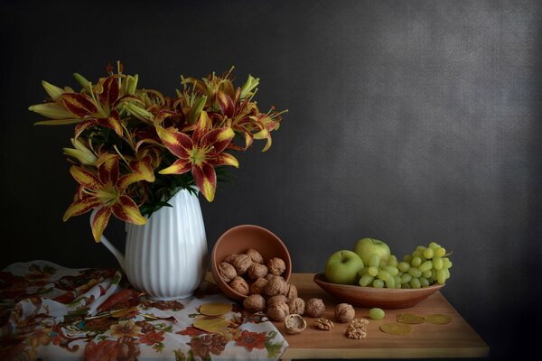 Still life of lilly nuts of green grapes