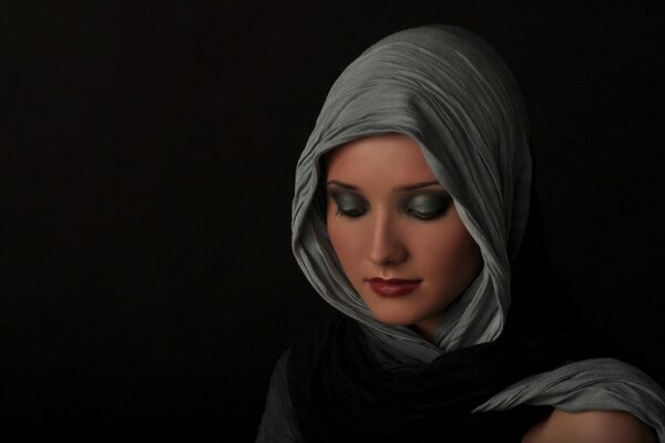 A girl with a shawl on her head