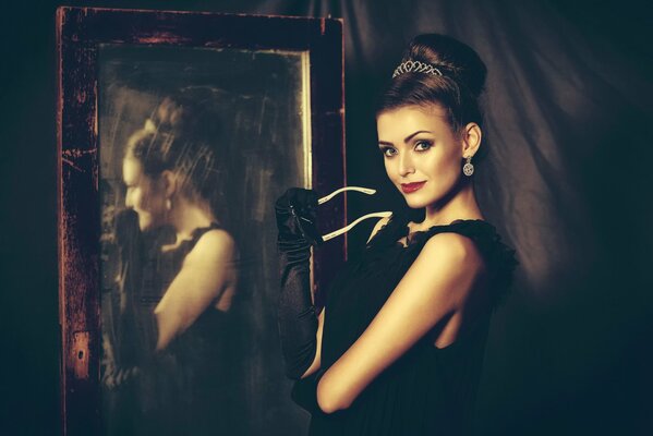 A girl reflected in a vintage mirror