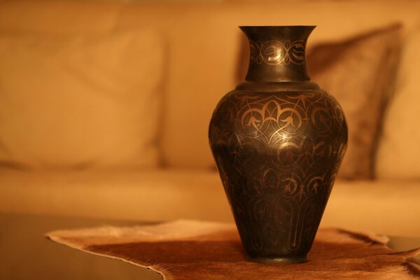 Vase in silver coinage in soft light