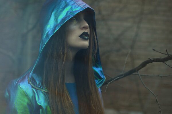 Gothic girl in a shiny jacket