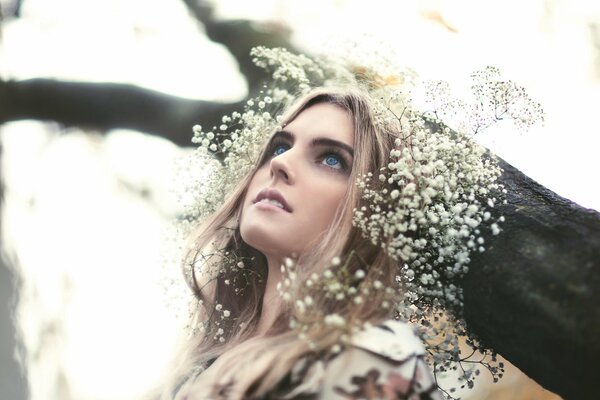 A girl with a wreath of dry flowers in her hair