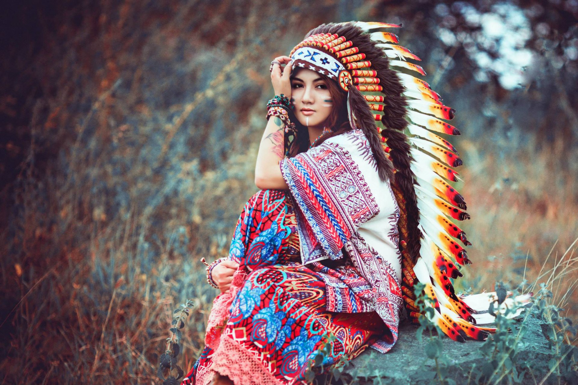 girl sitting face view headwear feathers nature