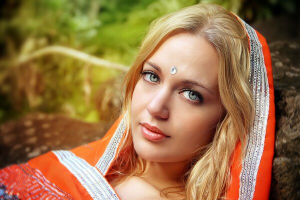 A girl in a sari with beautiful green eyes