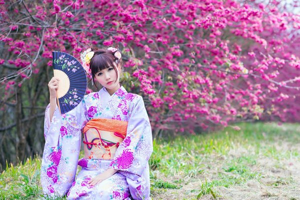 Japanese girl in a beautiful spring garden